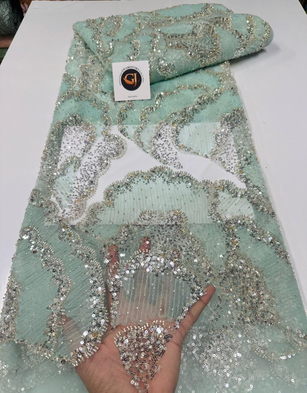 Tissu dentelle jaune soleil avec motifs floraux et sequins argentés