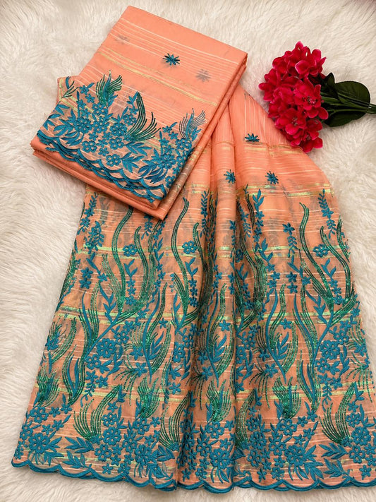 Salouva pêche et bleu turquoise brodée motifs floraux irisés reflets verts