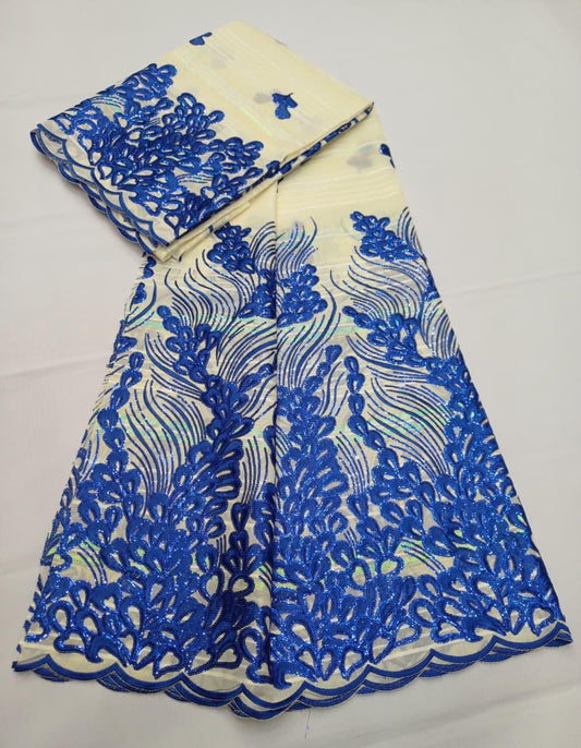 Tissu Salouva écru avec motifs dorés scintillants et bordure festonnée