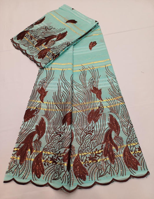 Tissu Salouva écru avec motifs bleu royal et bordure festonnée