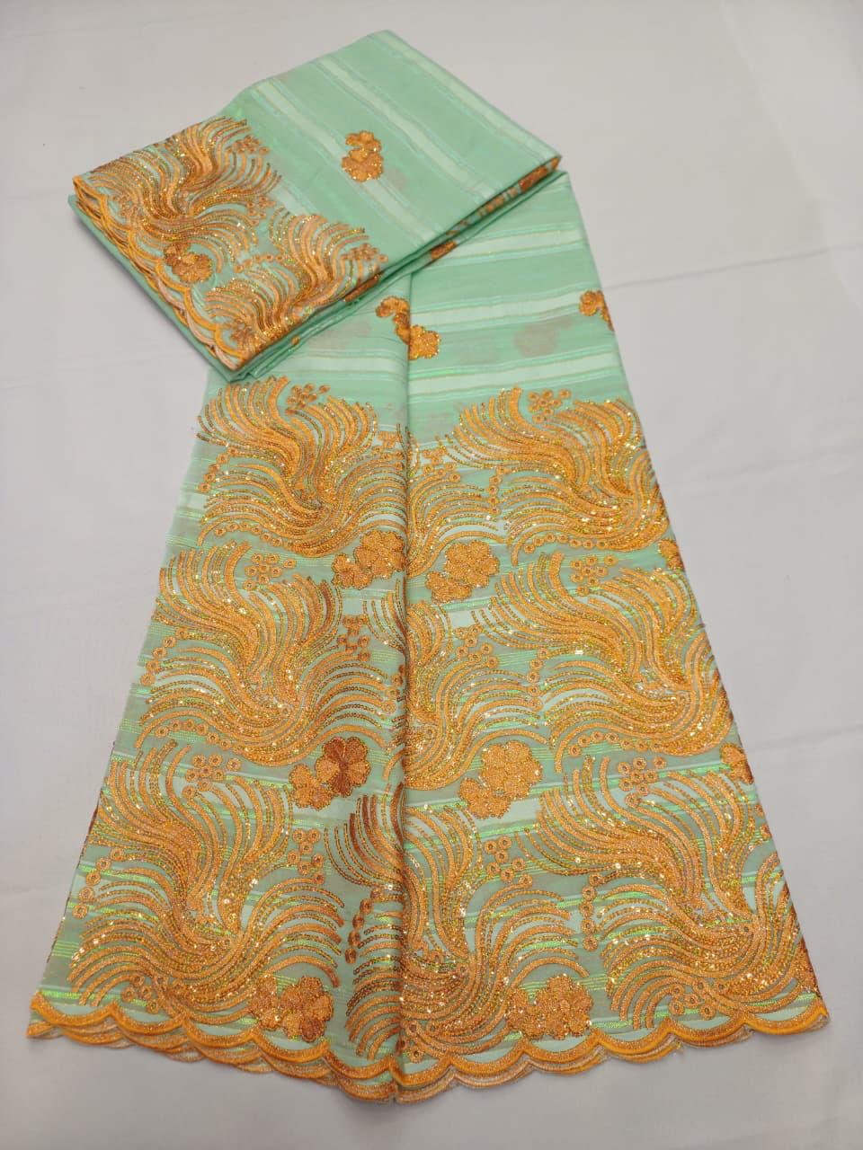 Tissu dentelle africain ivoire avec broderies flammes argentées