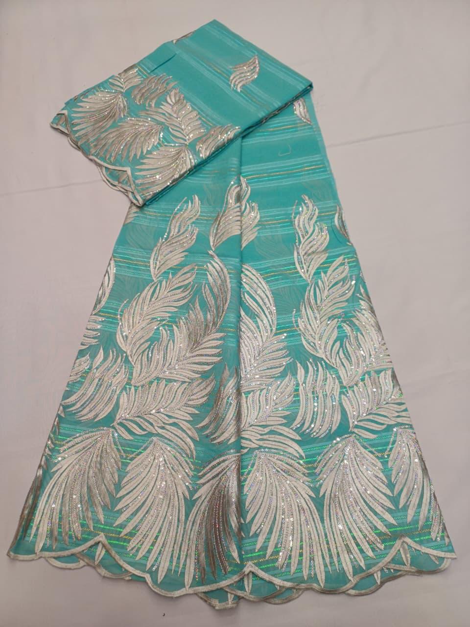 Tissu Salouva bleu marine avec motifs turquoise et bordure festonnée